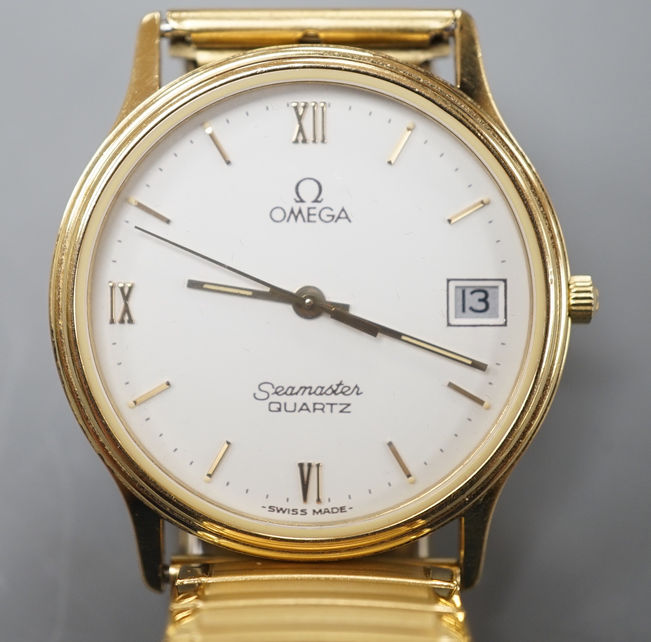 A gentleman's steel and gold plated Omega Seamaster quartz wrist watch, on associated flexible strap, with Omega box.